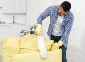 front-view-man-using-duster